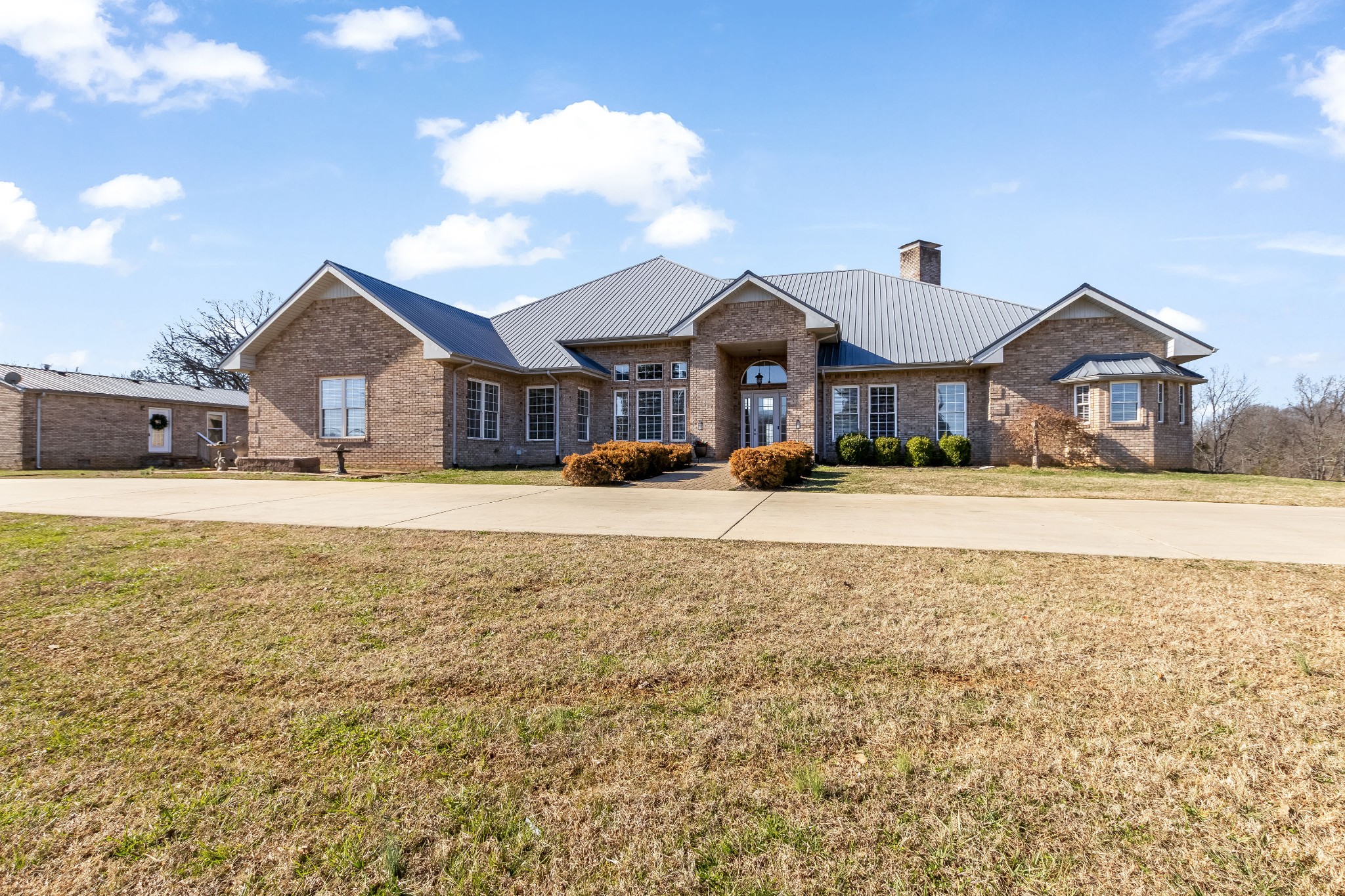 a front view of a house with a yard