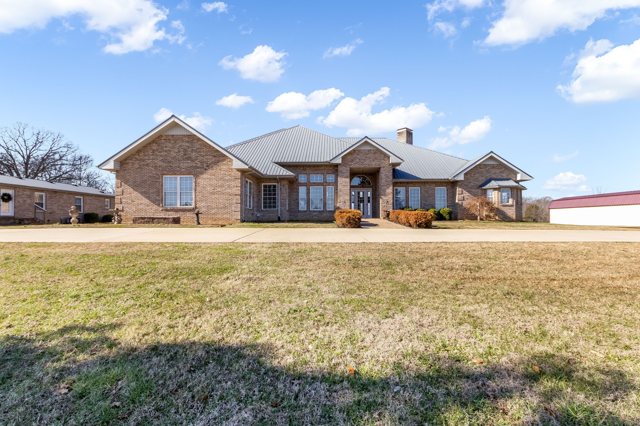 555 Randall Hitchcock Road Rock Island, TN 38581 - Photo 2 of 86 a front view of a house with a yard covered with snow and trees