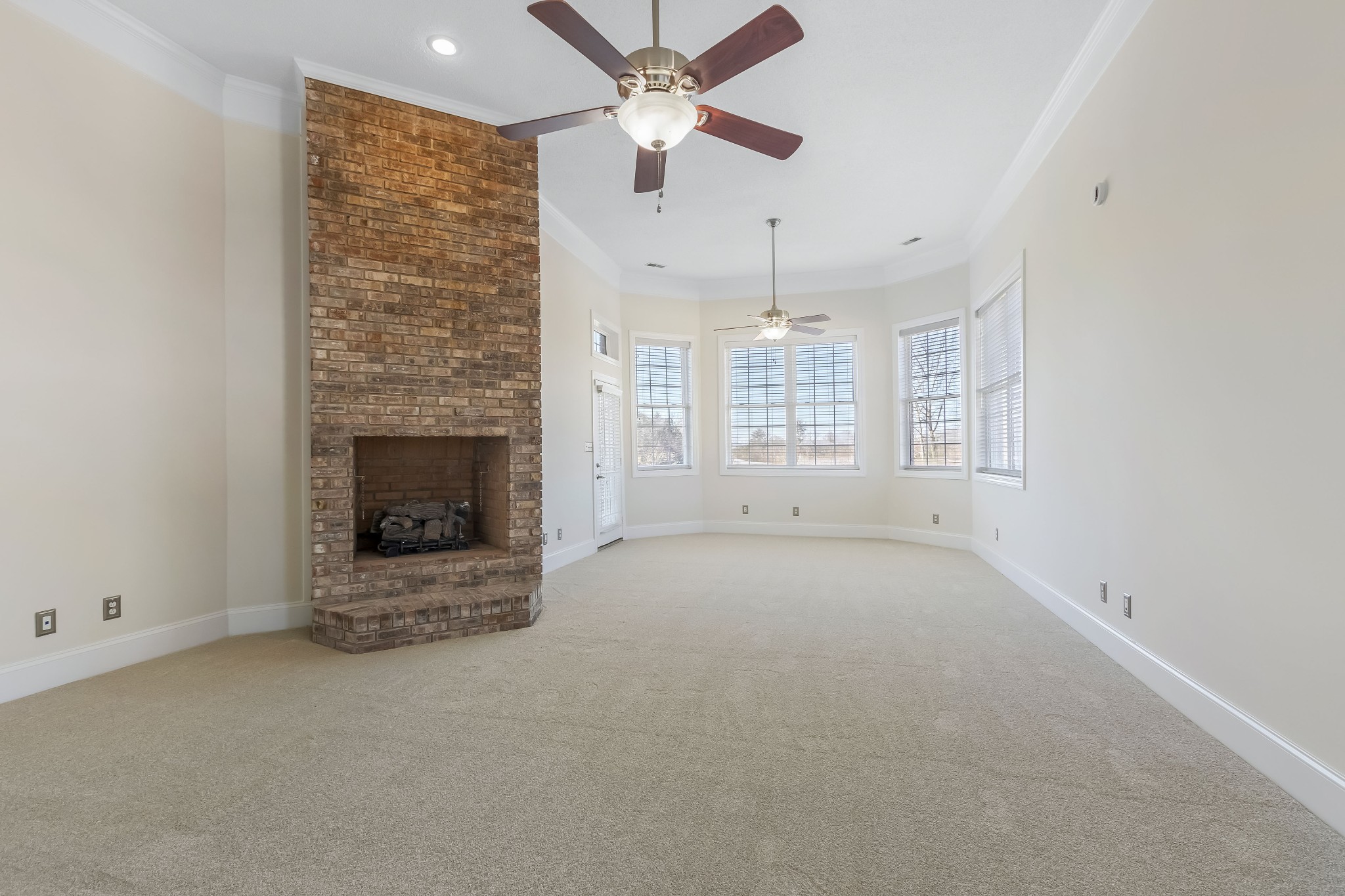 555 Randall Hitchcock Road Rock Island, TN 38581 - Photo 23 of 86 an empty room with windows and fireplace