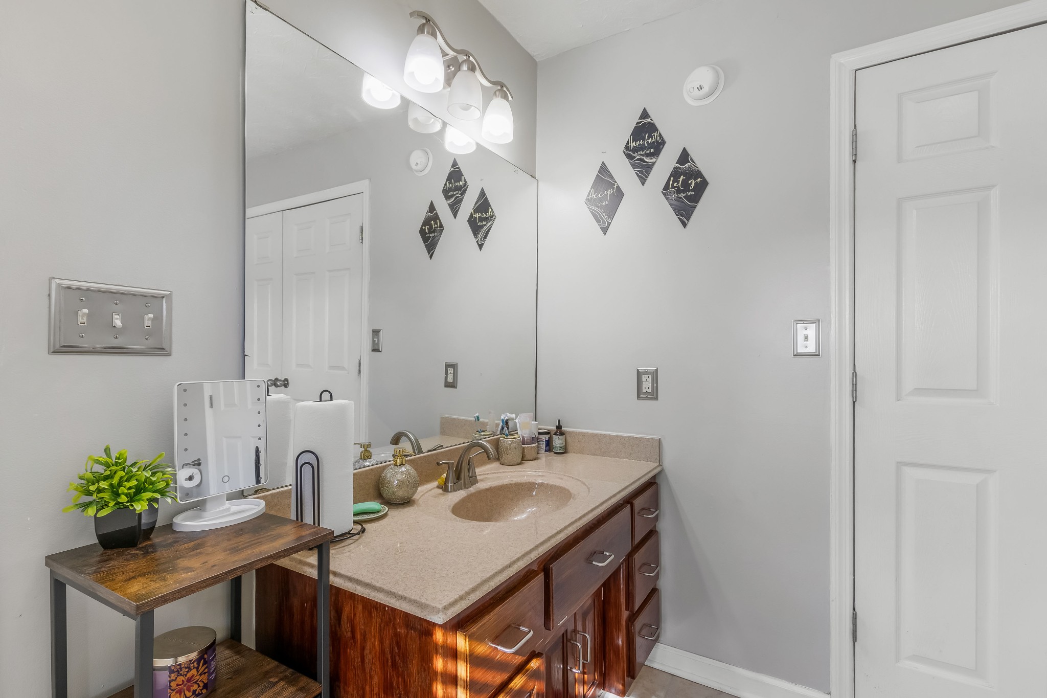 555 Randall Hitchcock Road Rock Island, TN 38581 - Photo 69 of 86 a bathroom with a granite countertop sink a mirror and vanity