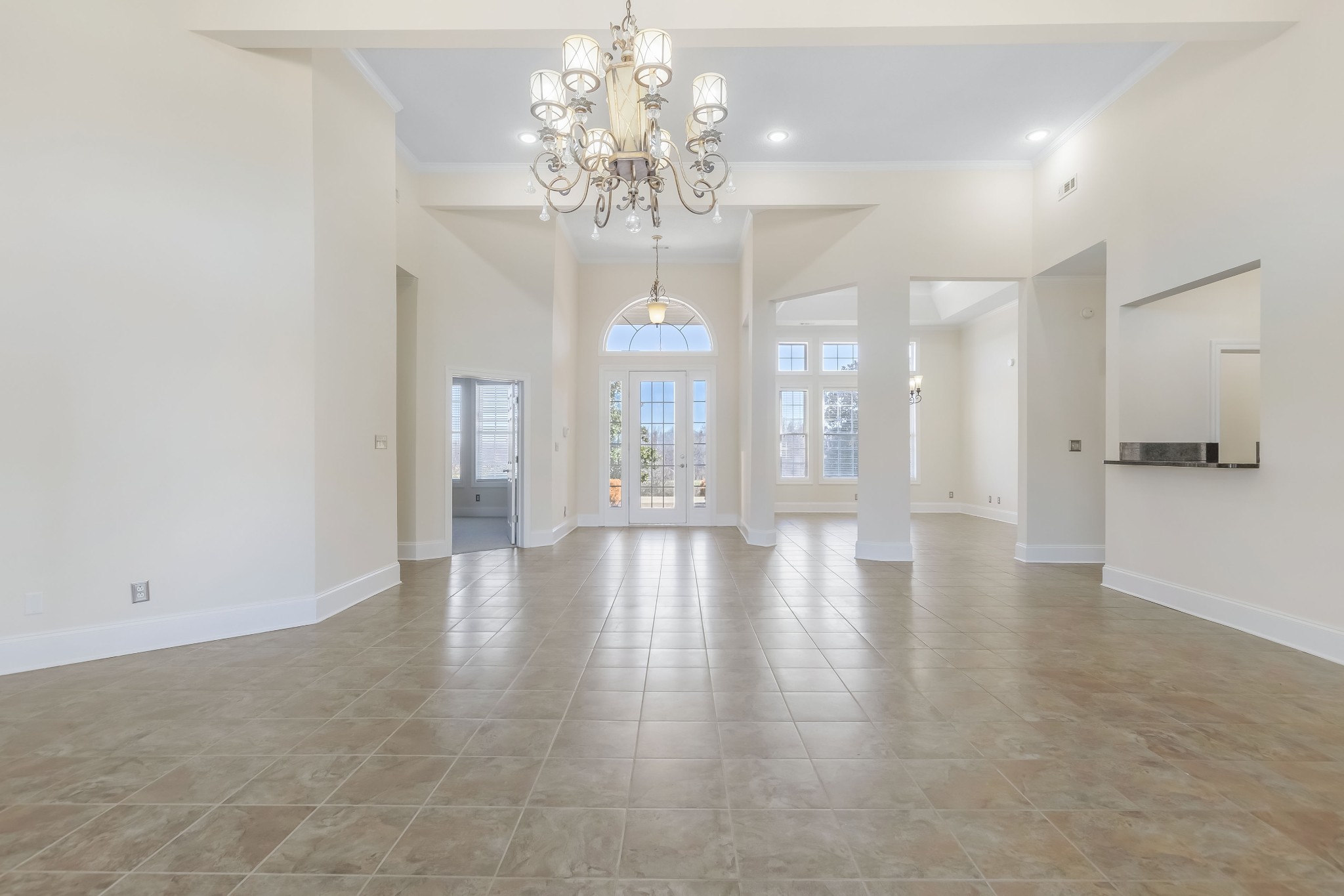 555 Randall Hitchcock Road Rock Island, TN 38581 - Photo 7 of 86 a view of an empty room with wooden floor and chandelier