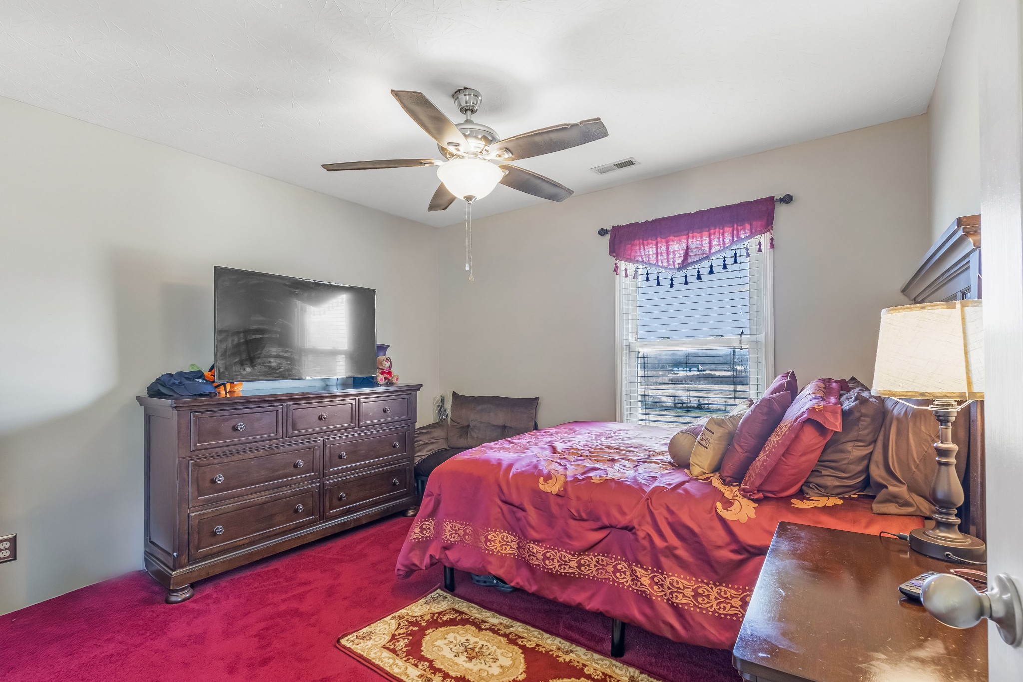 555 Randall Hitchcock Road Rock Island, TN 38581 - Photo 71 of 86 a bedroom with a bed and a flat screen tv