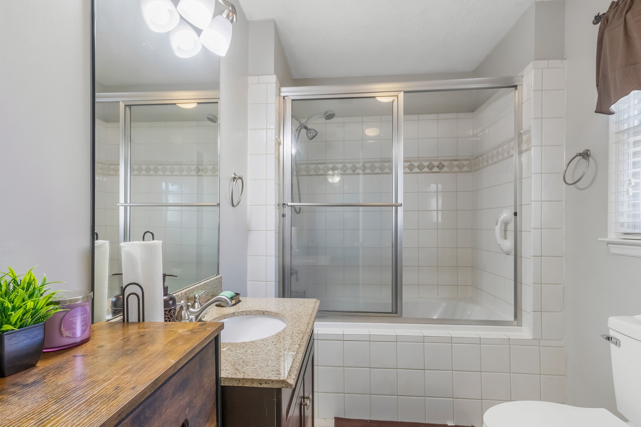 555 Randall Hitchcock Road Rock Island, TN 38581 - Photo 72 of 86 a bathroom with a granite countertop sink a toilet and shower