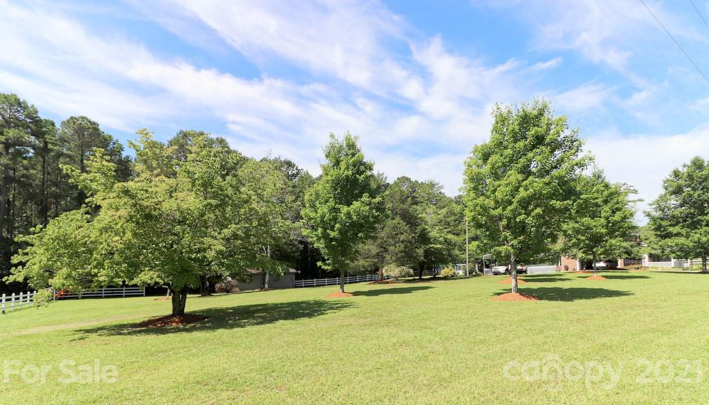 294 Holiday Road Lancaster, SC 29720 - Photo 16 of 48 a swimming pool with trees in the background