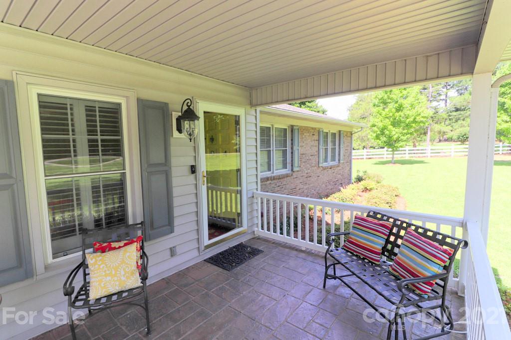 294 Holiday Road Lancaster, SC 29720 - Photo 19 of 48 a view of a porch with furniture and floor to ceiling window