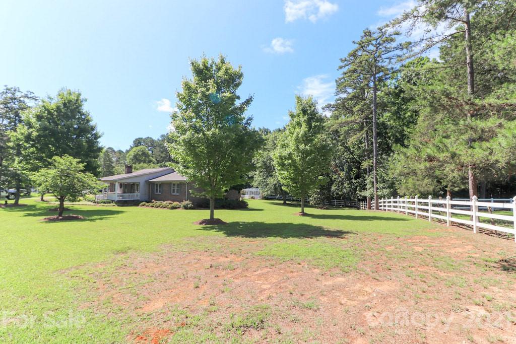 294 Holiday Road Lancaster, SC 29720 - Photo 3 of 48 a view of a swimming pool and a yard