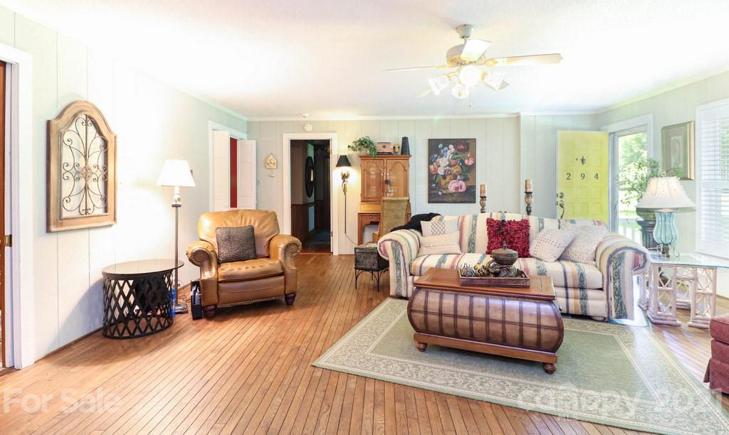 294 Holiday Road Lancaster, SC 29720 - Photo 23 of 48 a living room with furniture and a chandelier