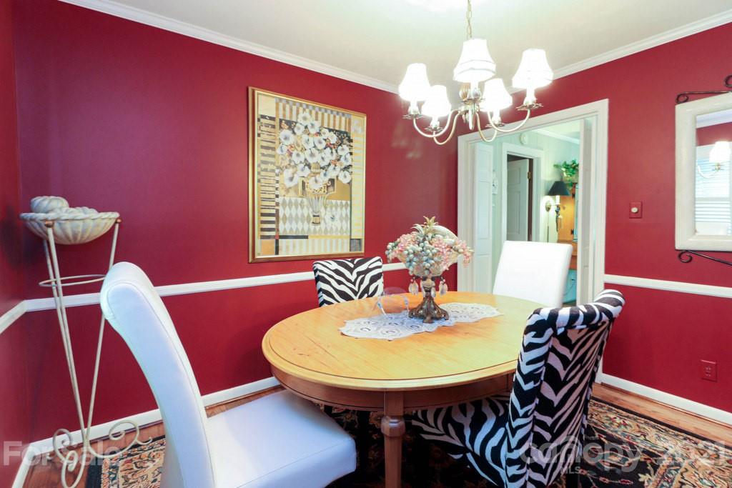 294 Holiday Road Lancaster, SC 29720 - Photo 27 of 48 a view of a dining room with furniture and chandelier