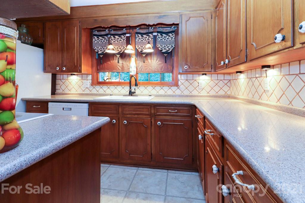 294 Holiday Road Lancaster, SC 29720 - Photo 29 of 48 a kitchen with granite countertop a sink and cabinets