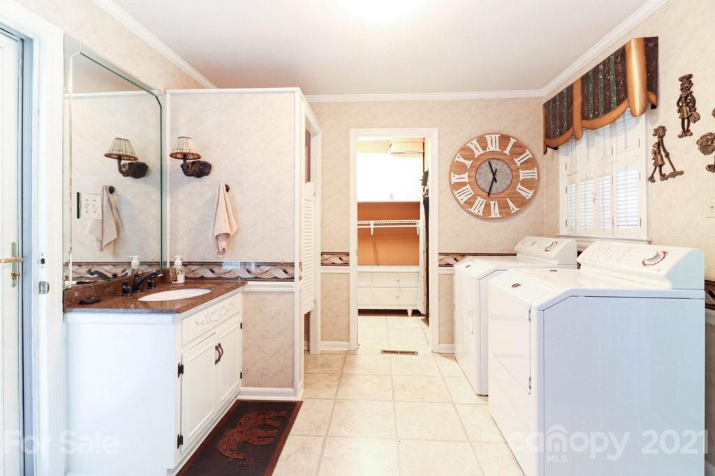 294 Holiday Road Lancaster, SC 29720 - Photo 32 of 48 a spacious bathroom with a sink and a mirror