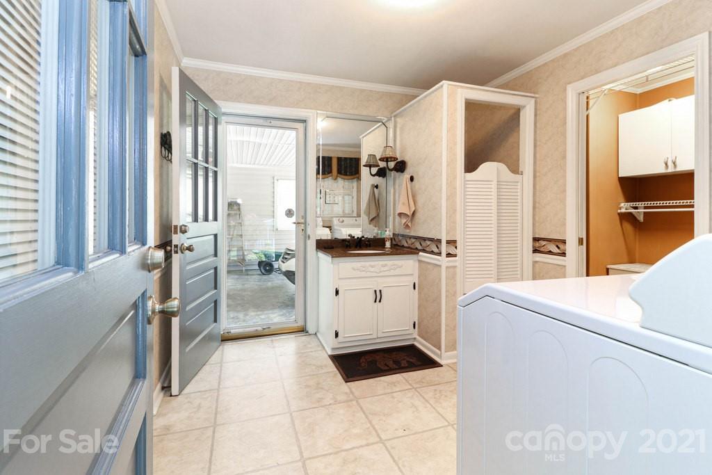 294 Holiday Road Lancaster, SC 29720 - Photo 33 of 48 a kitchen with a refrigerator and white cabinets