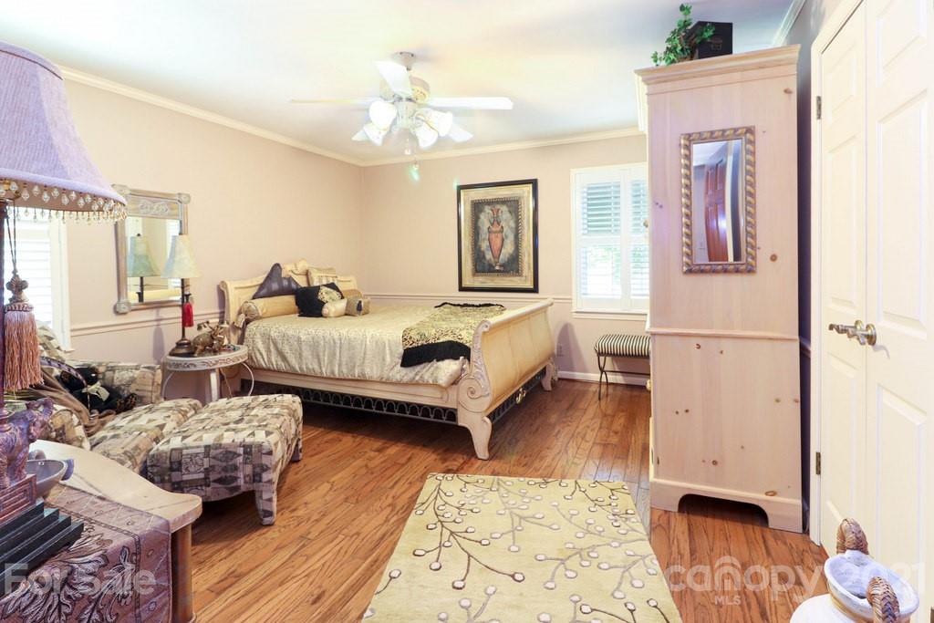 294 Holiday Road Lancaster, SC 29720 - Photo 39 of 48 a spacious bedroom with a bed a couch and dresser