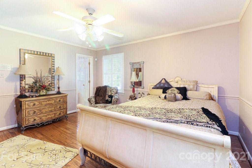 294 Holiday Road Lancaster, SC 29720 - Photo 41 of 48 a bedroom with a bed and wooden floor