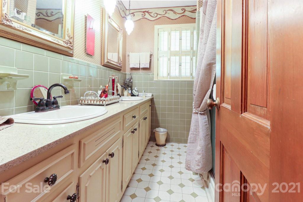294 Holiday Road Lancaster, SC 29720 - Photo 47 of 48 a bathroom with a sink a mirror and a shower