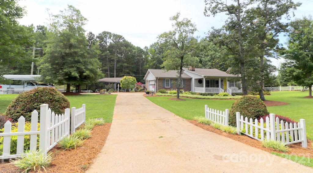 294 Holiday Road Lancaster, SC 29720 - Photo 48 of 48 a view of house with swimming pool and green space