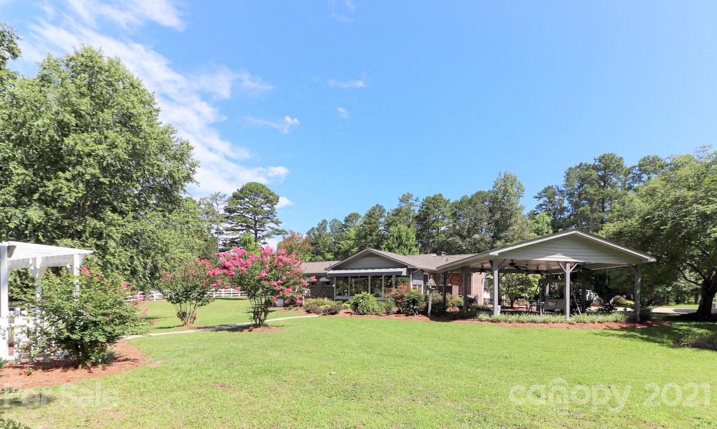 294 Holiday Road Lancaster, SC 29720 - Photo 9 of 48 a front view of a house with garden