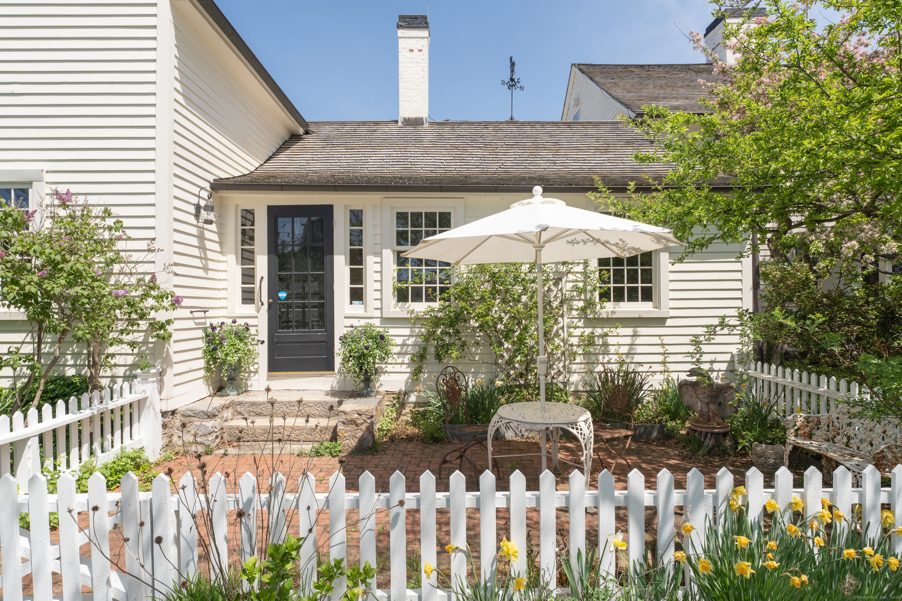 175 North Cove Road Old Saybrook, CT 06475 - Photo 12 of 40 a front view of a house with a yard
