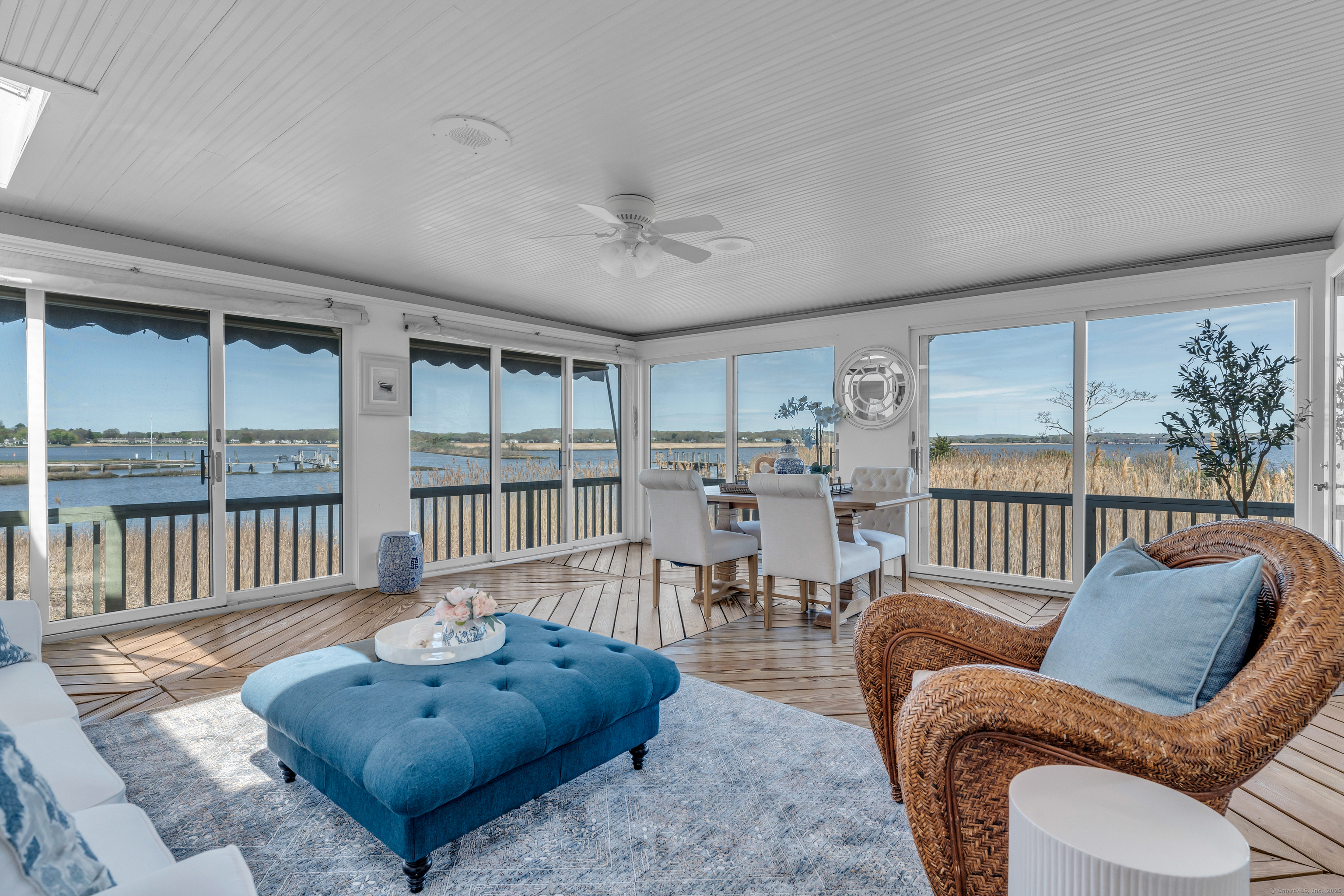 175 North Cove Road Old Saybrook, CT 06475 - Photo 14 of 40 a living room with furniture and a floor to ceiling window