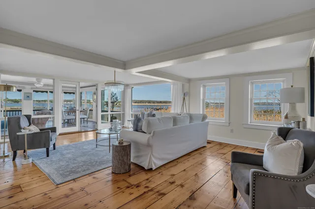 a living room with furniture rug and window