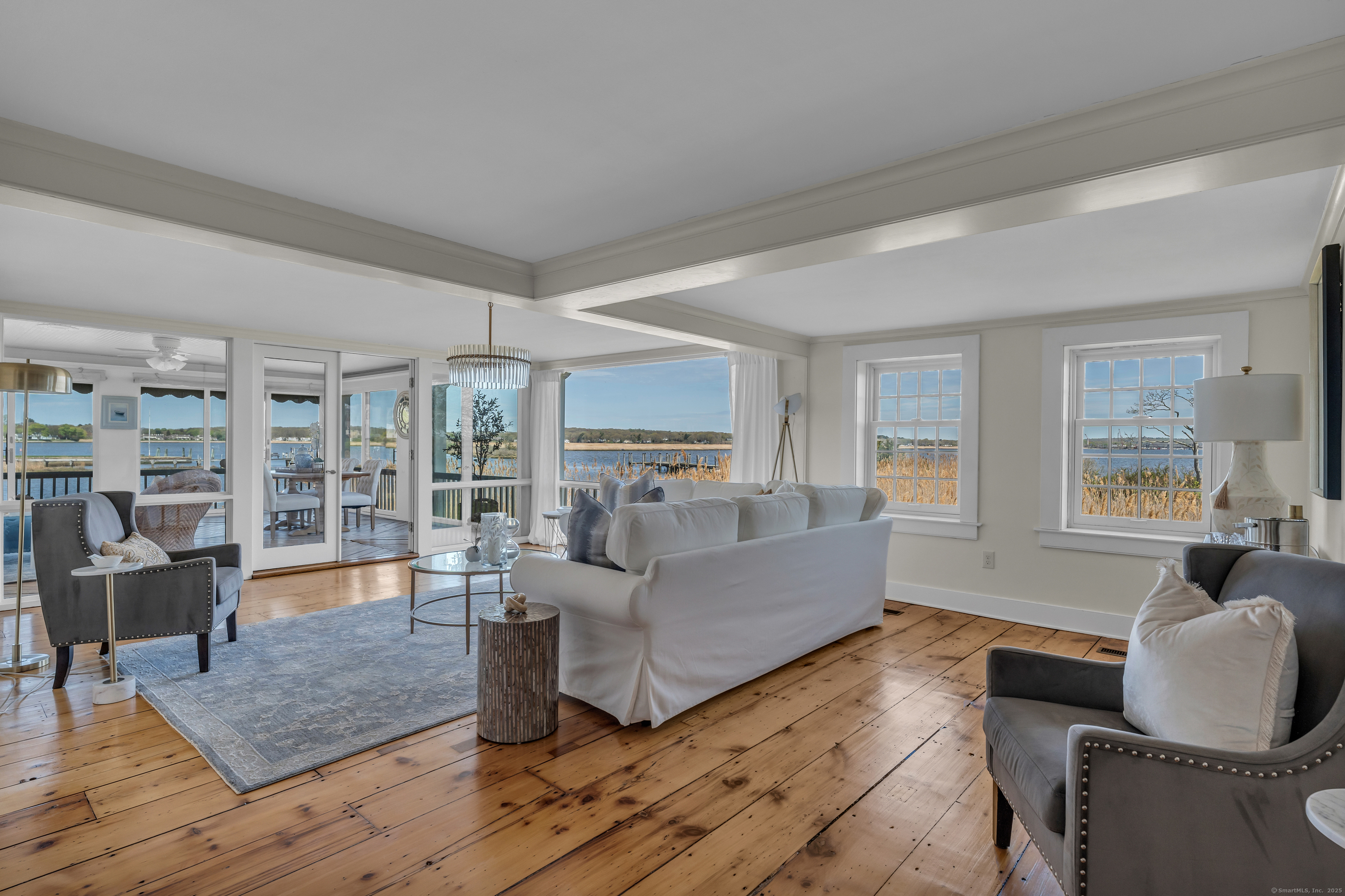 175 North Cove Road Old Saybrook, CT 06475 - Photo 18 of 40 a living room with furniture and a large window