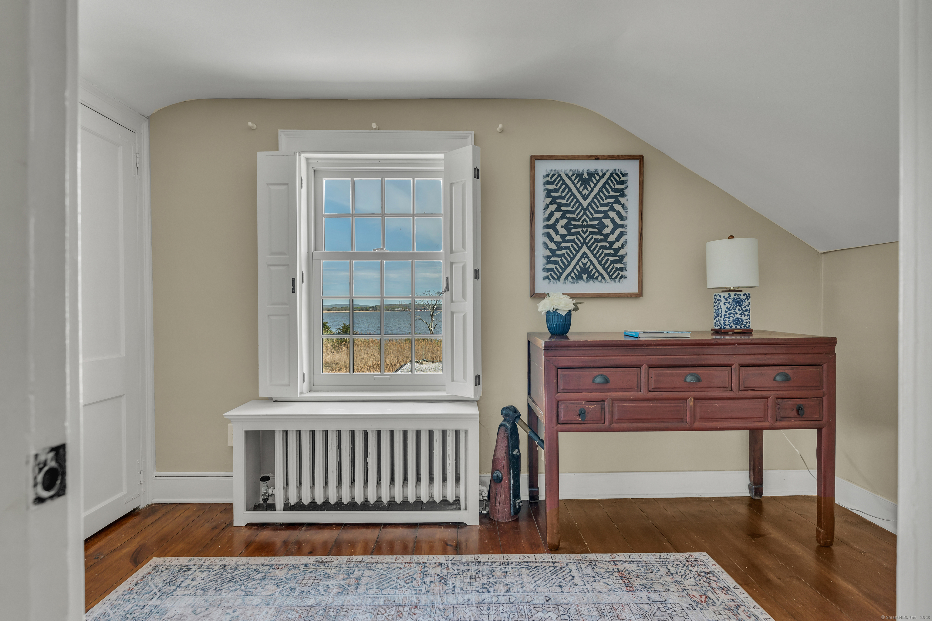 175 North Cove Road Old Saybrook, CT 06475 - Photo 30 of 40 a bedroom with a bed and window