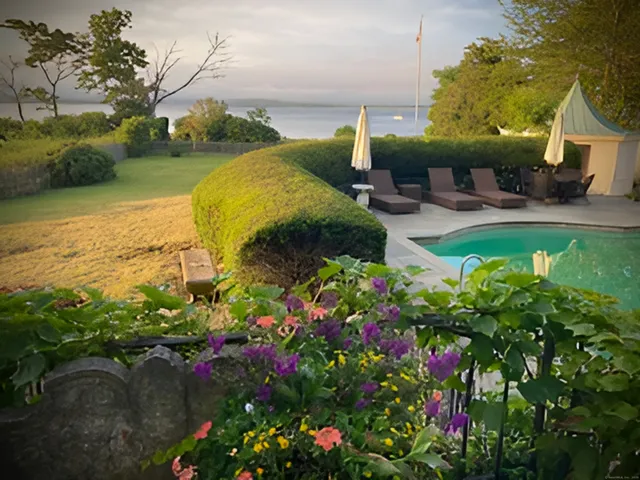 an aerial view of a house with a garden and plants