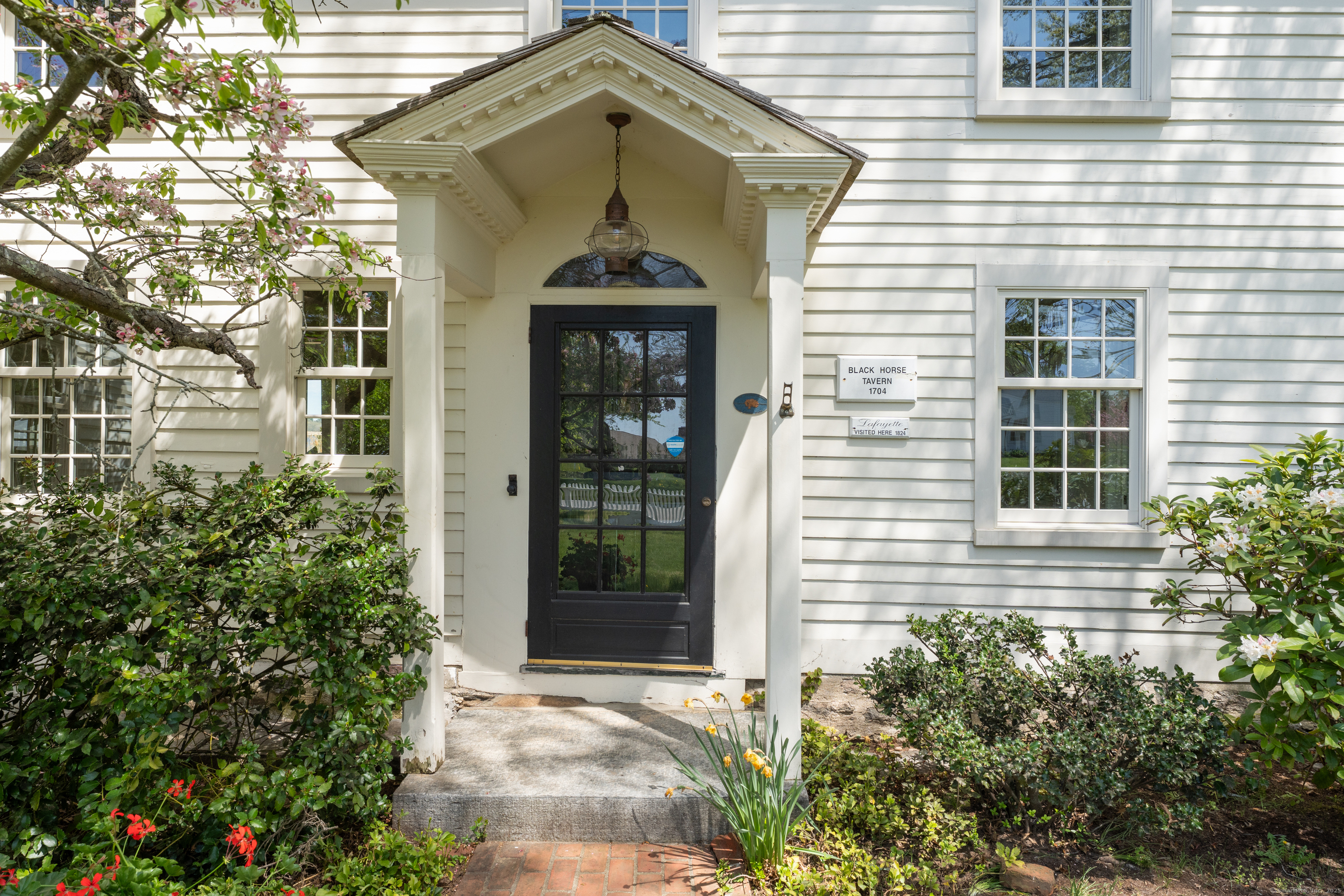 175 North Cove Road Old Saybrook, CT 06475 - Photo 5 of 40 a front view of a house with a yard