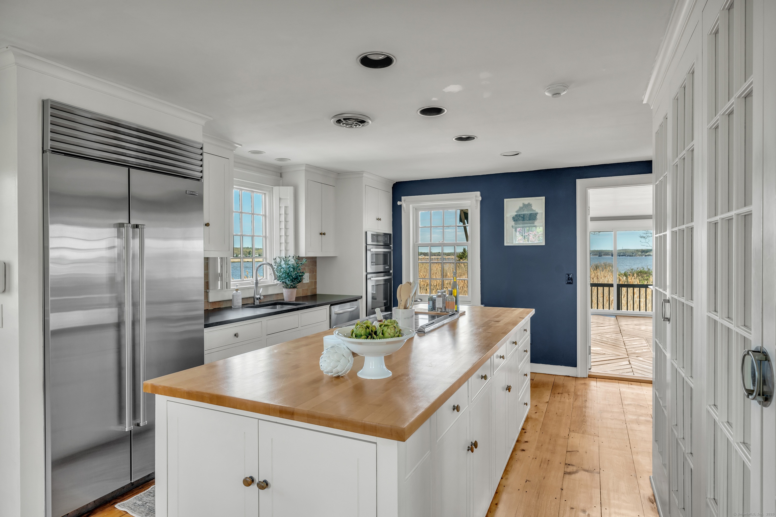 175 North Cove Road Old Saybrook, CT 06475 - Photo 8 of 40 a kitchen with stainless steel appliances granite countertop a sink and a refrigerator