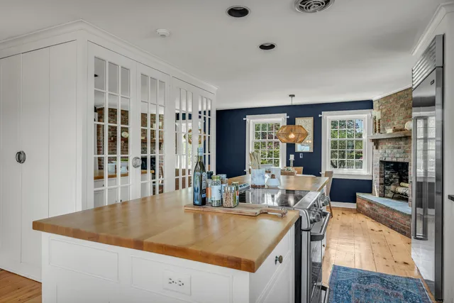 a kitchen with stainless steel appliances granite countertop a sink and a refrigerator