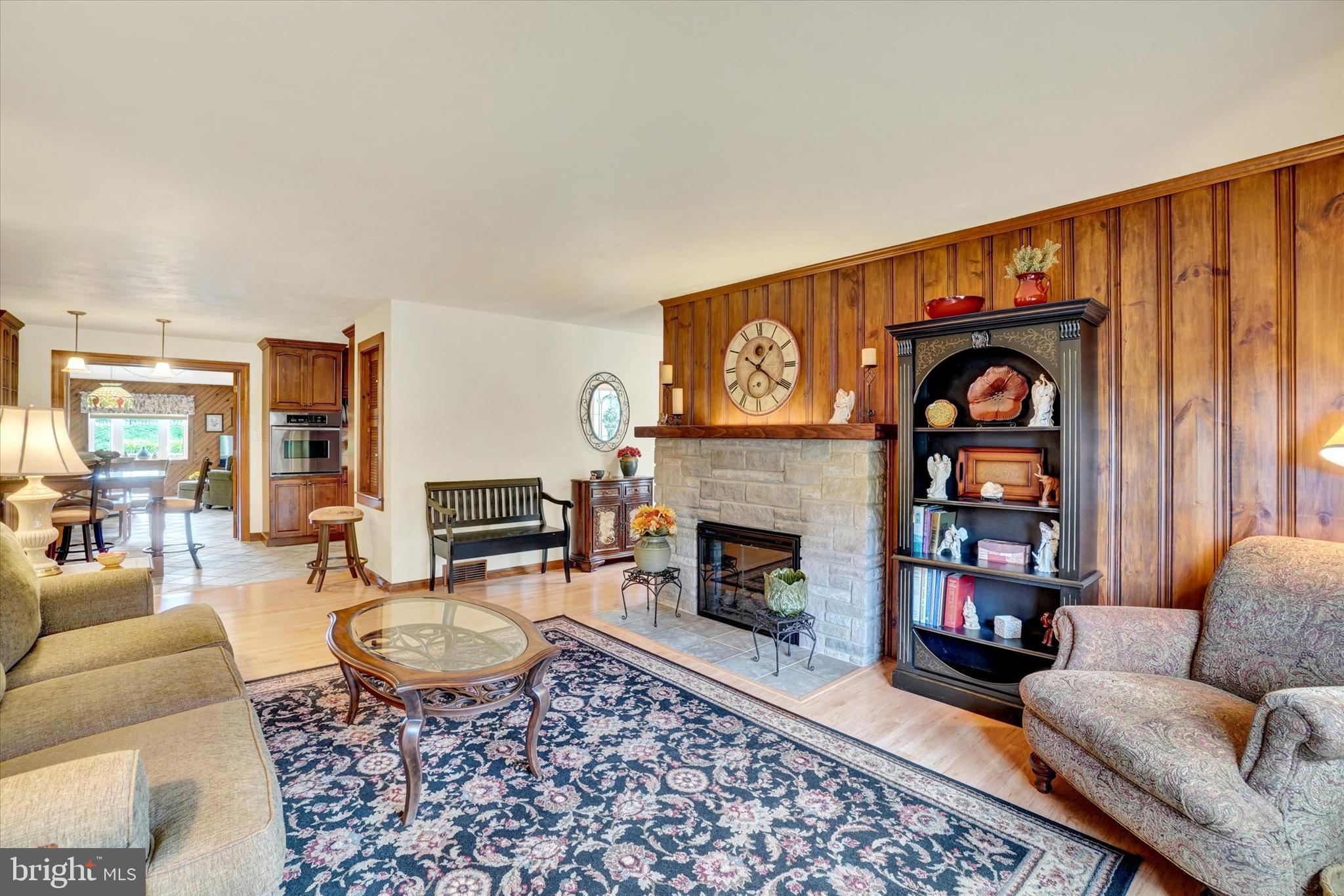 285 South Main Street Mount Wolf, PA 17347 - Photo 6 of 34 a living room with furniture a rug and a fireplace