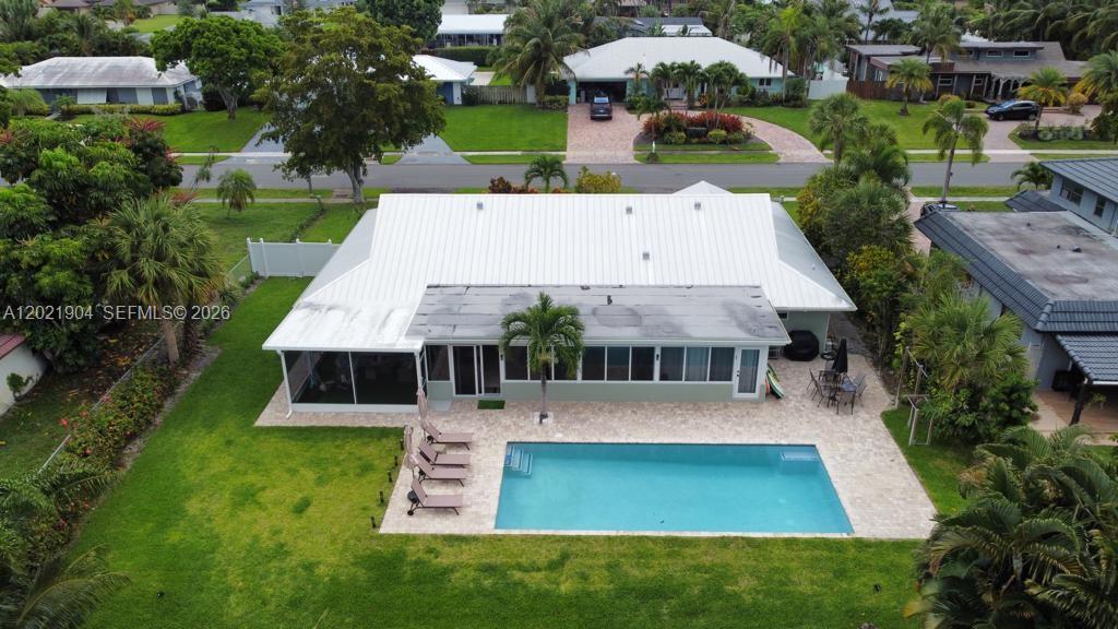 3324 Lakeview Boulevard Delray Beach, FL 33445 - Photo 29 of 36 an aerial view of a house with swimming pool garden and patio