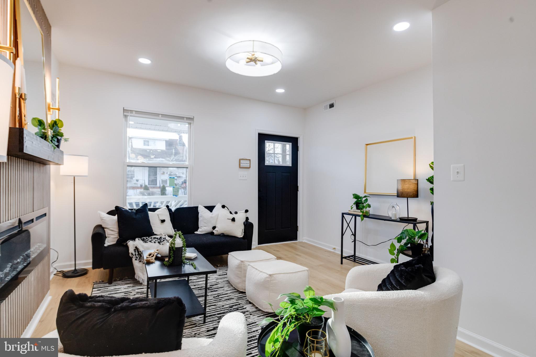 5805 Highgate Drive Baltimore, MD 21215 - Photo 11 of 69 a living room with furniture potted plant and a window