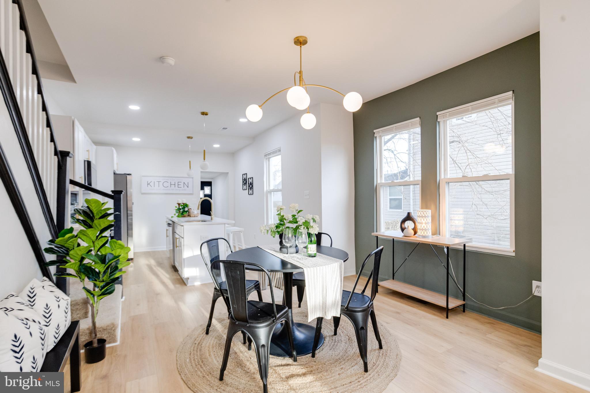 5805 Highgate Drive Baltimore, MD 21215 - Photo 12 of 69 a view of a dining room with furniture window and wooden floor