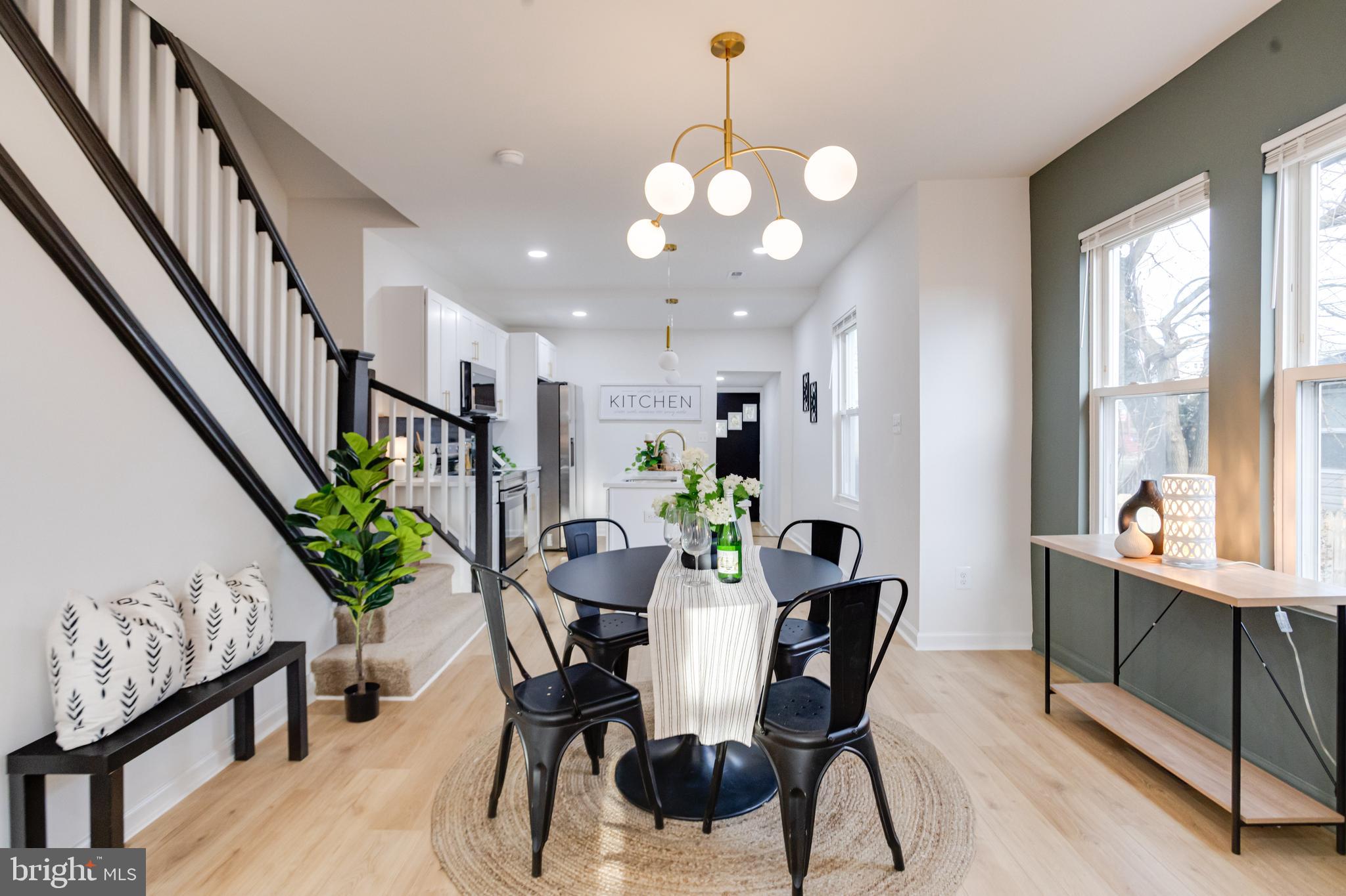 5805 Highgate Drive Baltimore, MD 21215 - Photo 13 of 69 a view of a dining room with furniture window and wooden floor