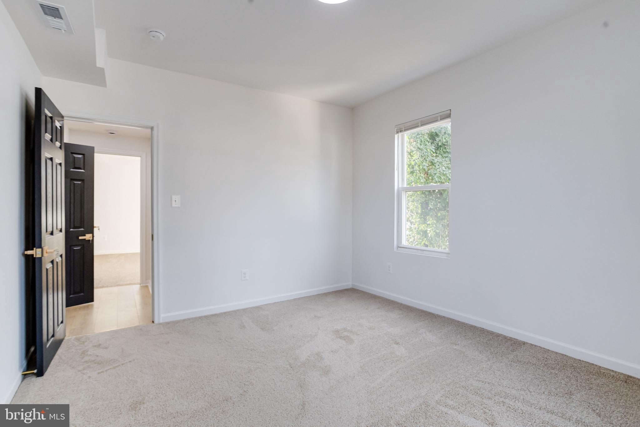 5805 Highgate Drive Baltimore, MD 21215 - Photo 28 of 69 an empty room with windows