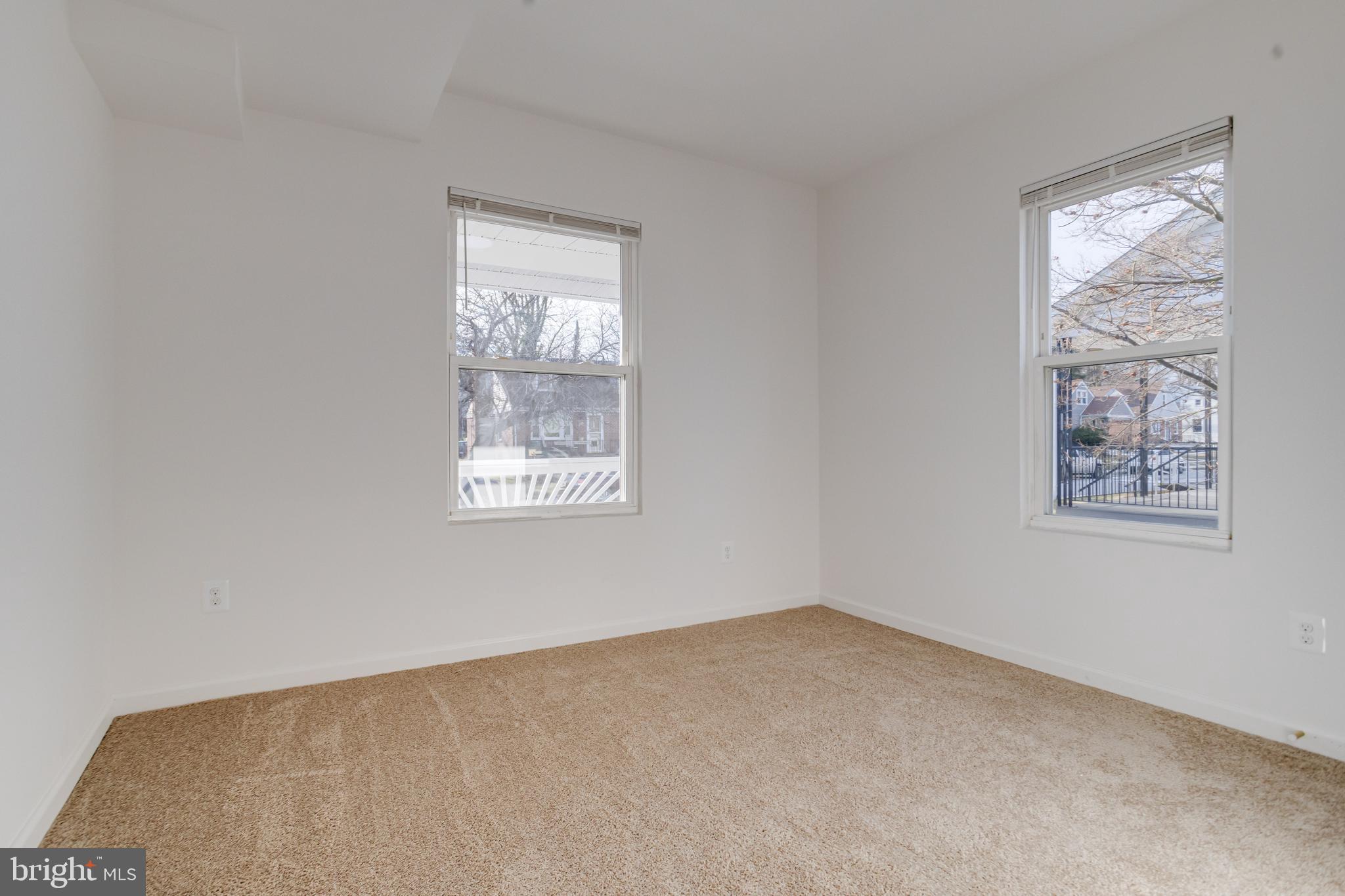 5805 Highgate Drive Baltimore, MD 21215 - Photo 29 of 69 an empty room with windows