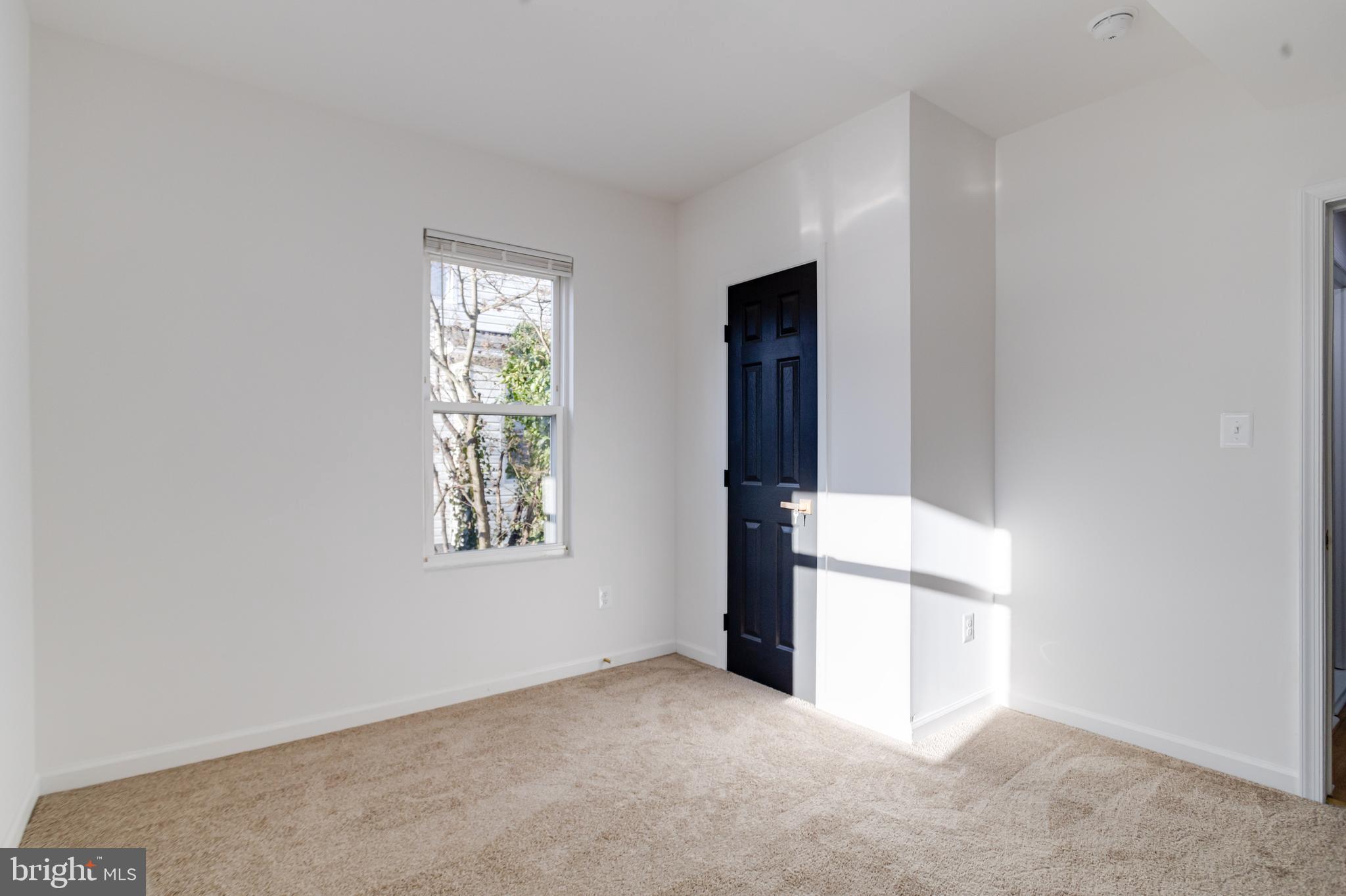 5805 Highgate Drive Baltimore, MD 21215 - Photo 31 of 69 an empty room with windows