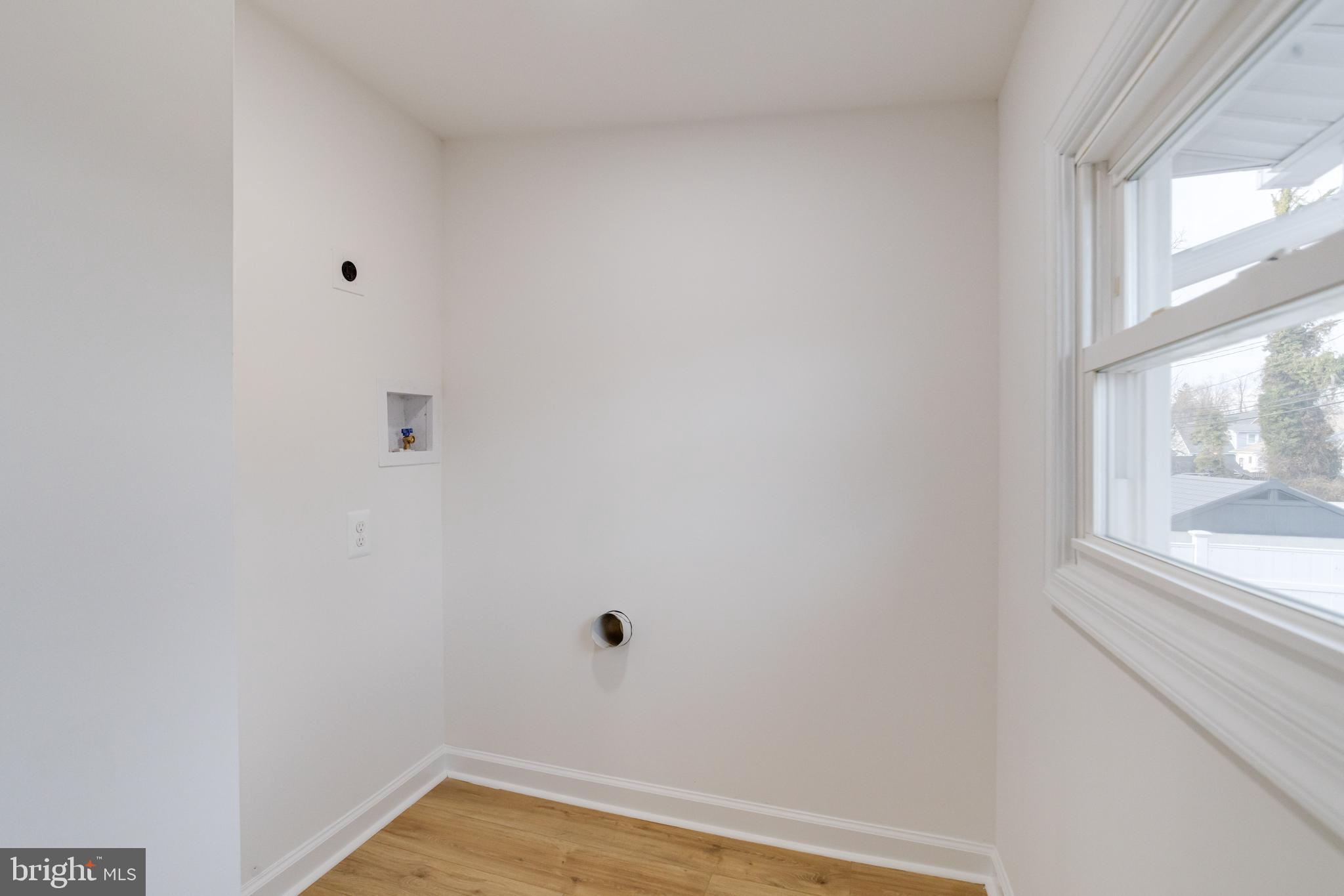 5805 Highgate Drive Baltimore, MD 21215 - Photo 34 of 69 a view of a small space with wooden floor and a window