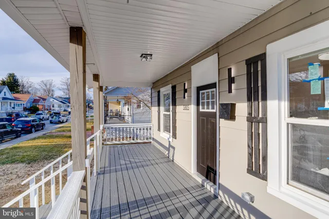 a view of a porch with wooden floor and outdoor space