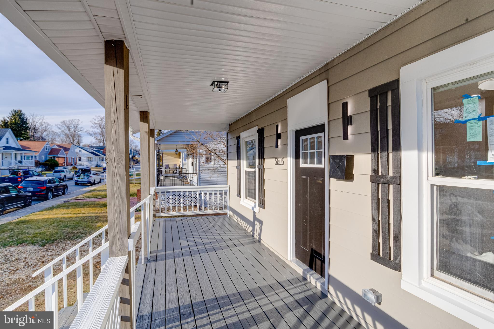5805 Highgate Drive Baltimore, MD 21215 - Photo 4 of 69 a view of a porch with wooden floor and outdoor space