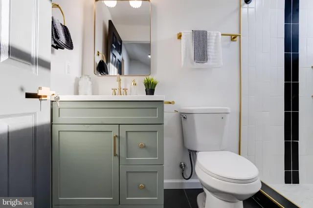 a living room with furniture and flowers