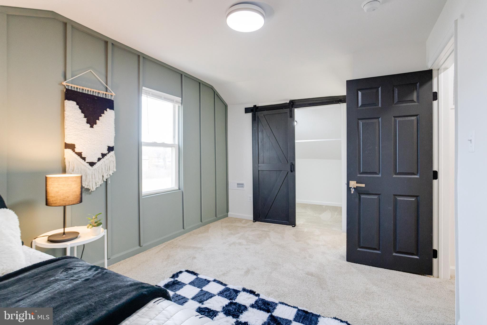 5805 Highgate Drive Baltimore, MD 21215 - Photo 48 of 69 a bedroom with a bed and wooden floor