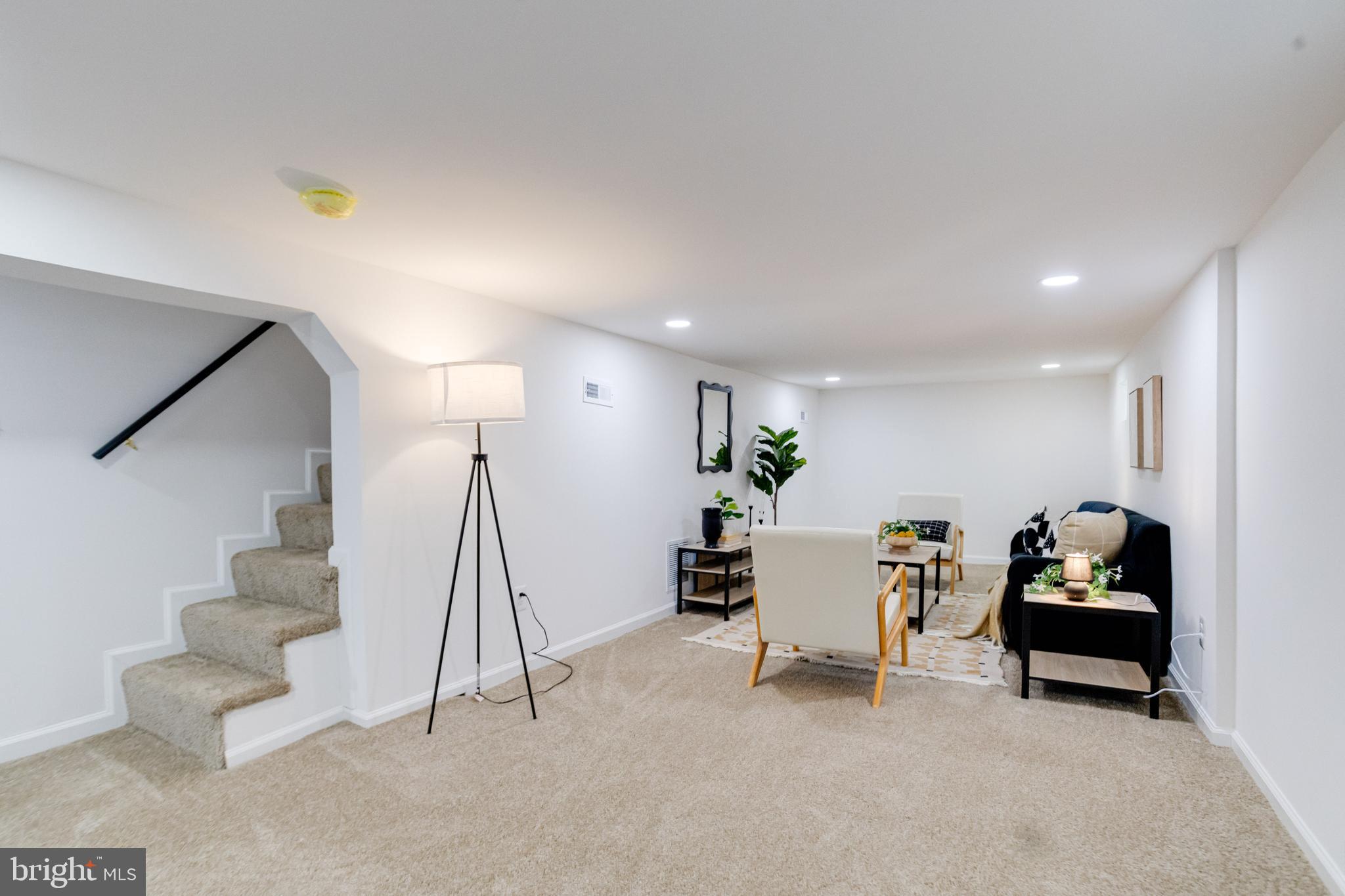5805 Highgate Drive Baltimore, MD 21215 - Photo 54 of 69 a view of a livingroom with furniture and white walls