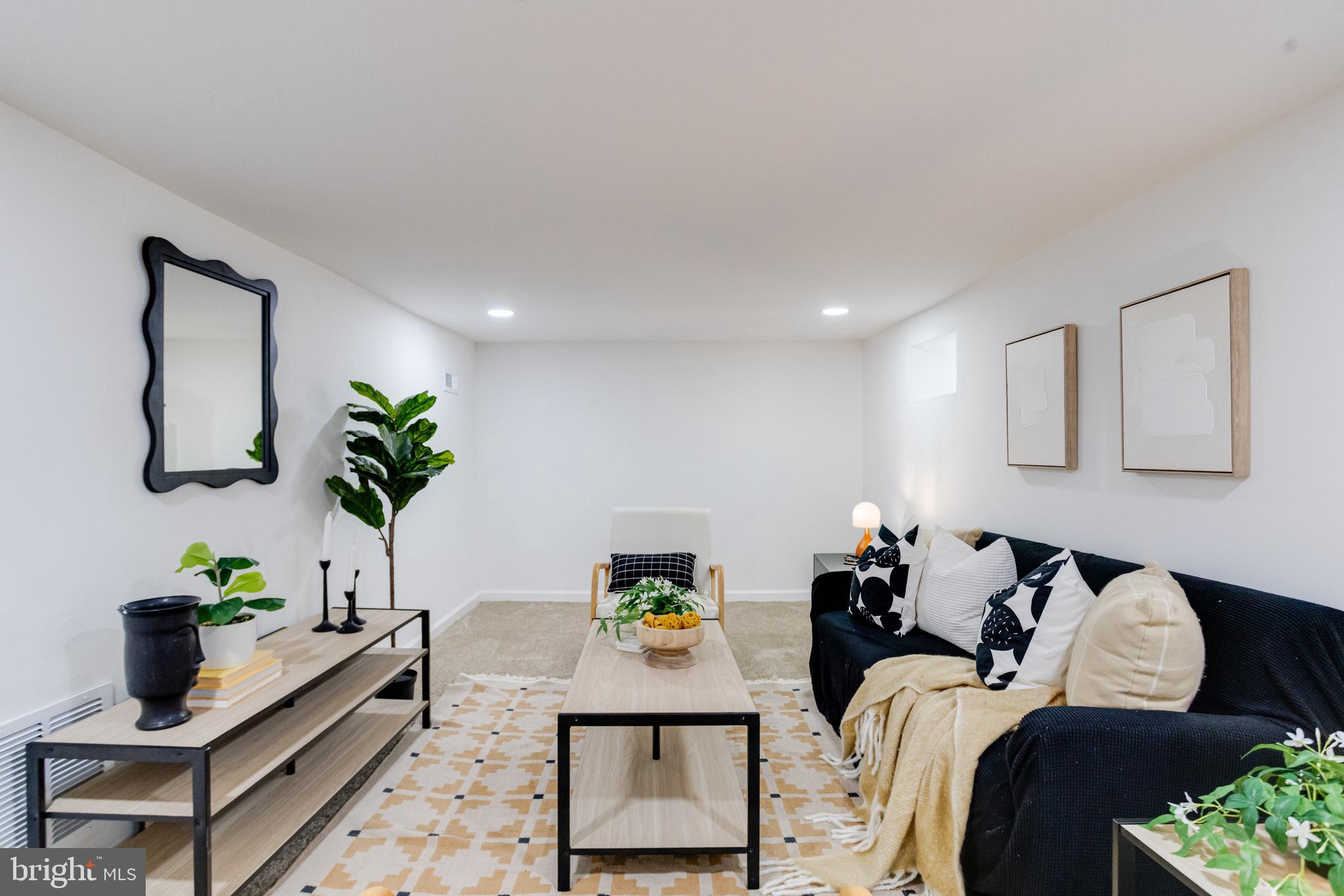 5805 Highgate Drive Baltimore, MD 21215 - Photo 55 of 69 a living room with furniture and flowers