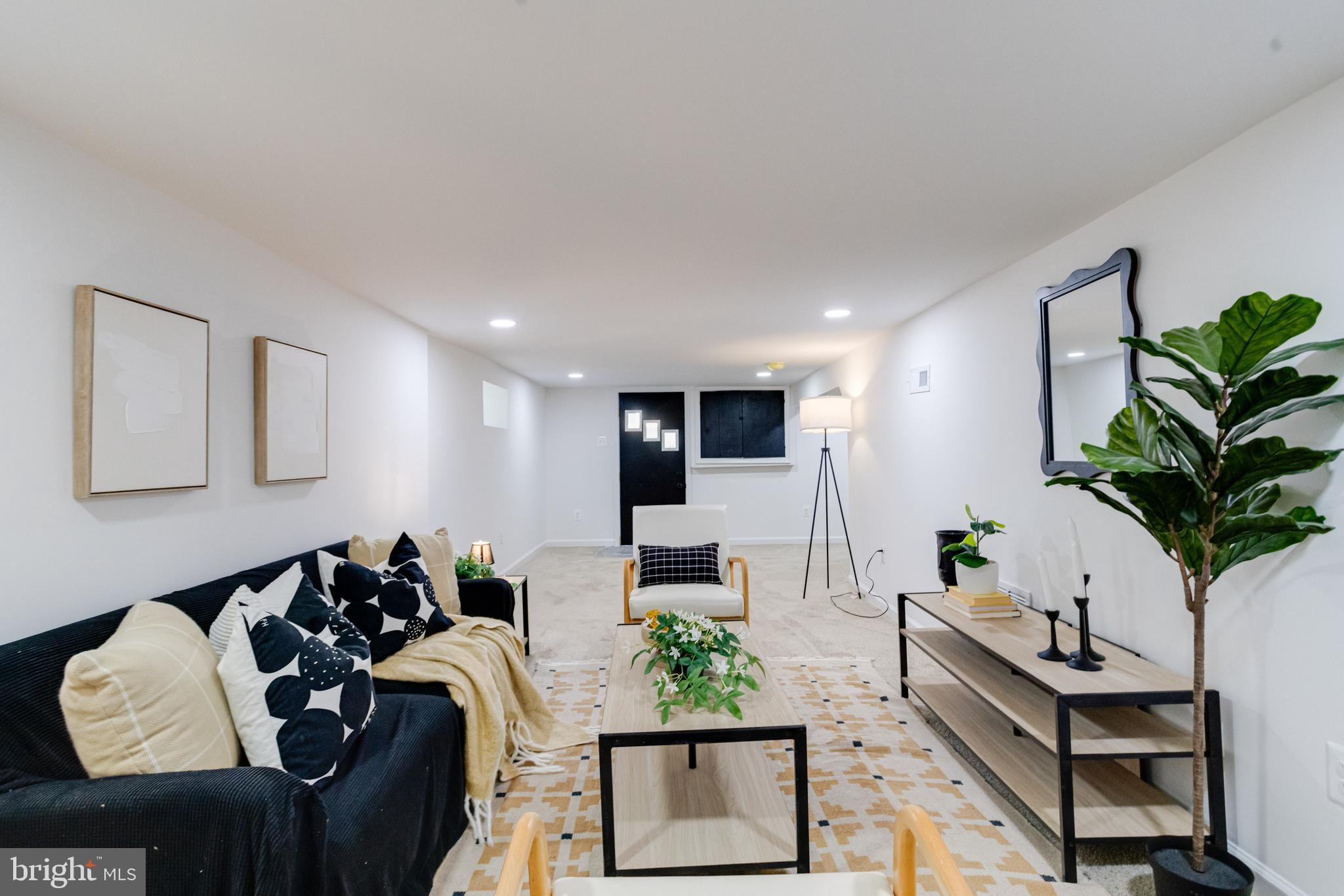 5805 Highgate Drive Baltimore, MD 21215 - Photo 59 of 69 a living room with furniture potted plant and a window