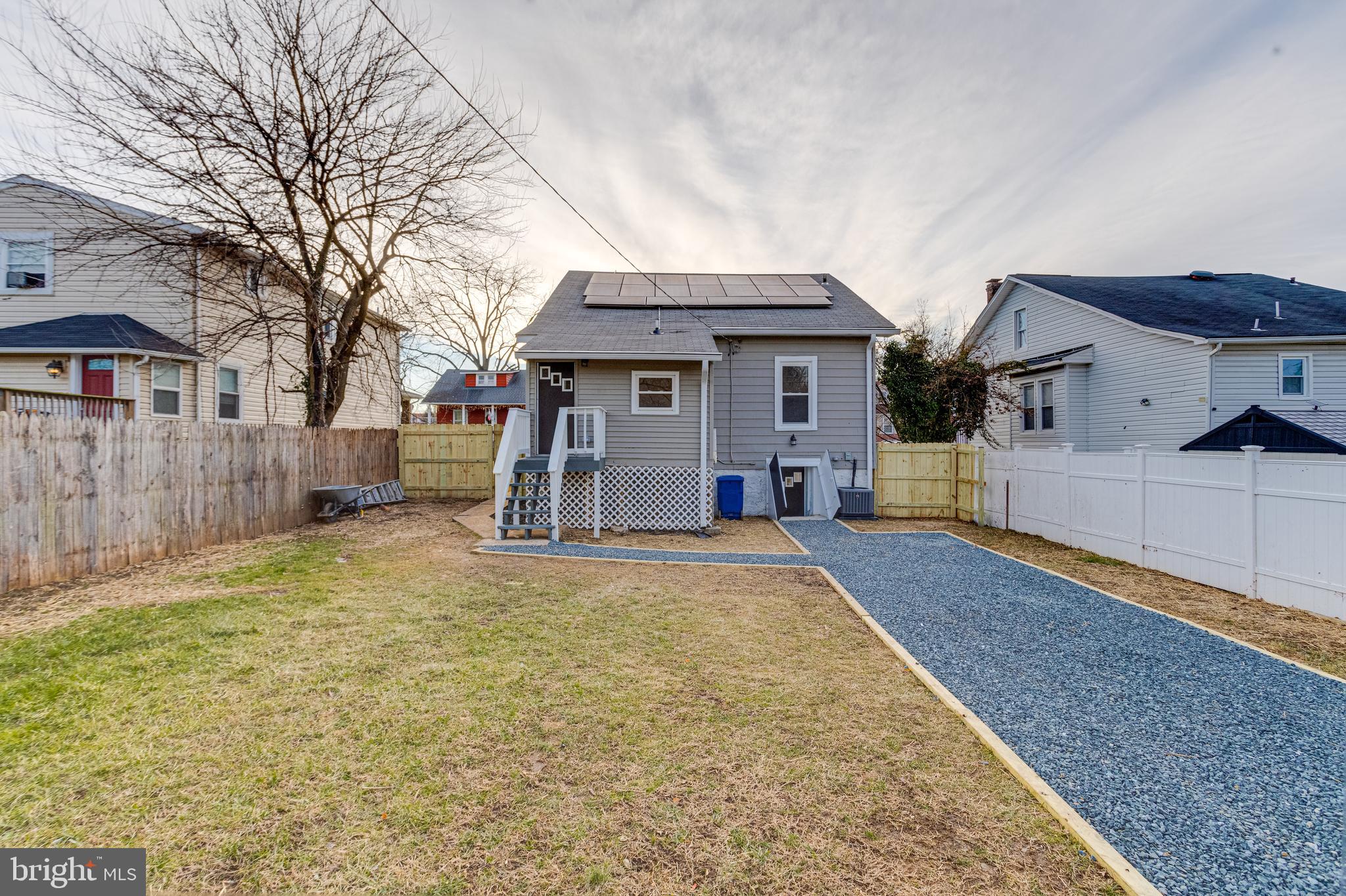 5805 Highgate Drive Baltimore, MD 21215 - Photo 69 of 69 a front view of a house with a yard and garage