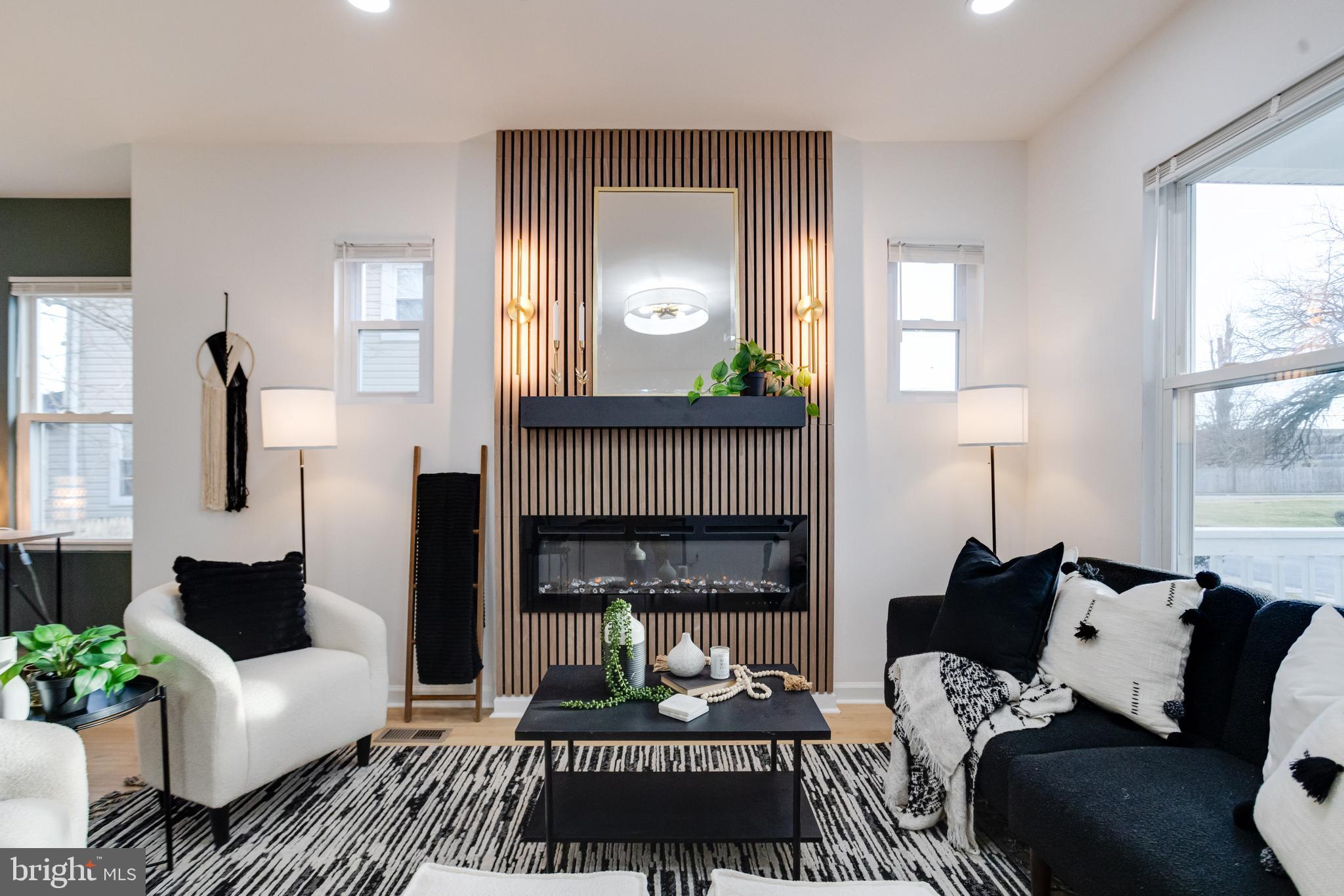 5805 Highgate Drive Baltimore, MD 21215 - Photo 7 of 69 a living room with furniture and a fireplace