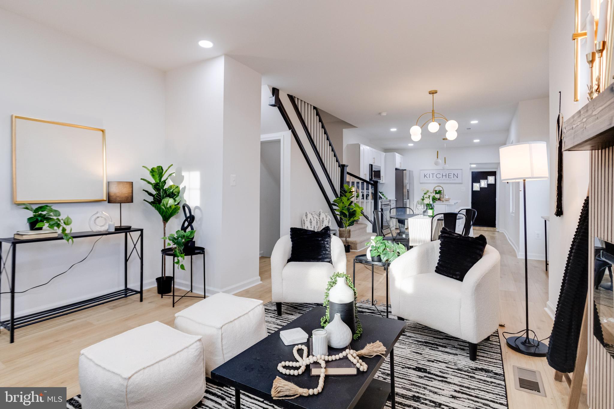 5805 Highgate Drive Baltimore, MD 21215 - Photo 8 of 69 a living room with furniture and a chandelier