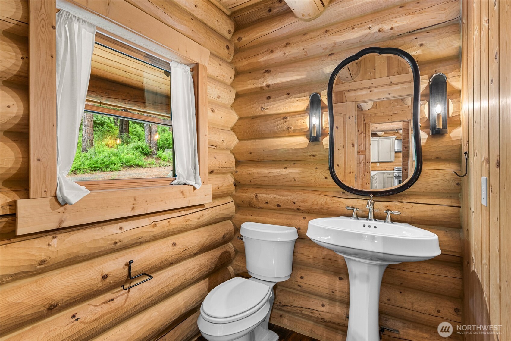 3888 Camas Creek Road Peshastin, WA 98847 - Photo 8 of 40 a bathroom with a toilet a sink and a mirror