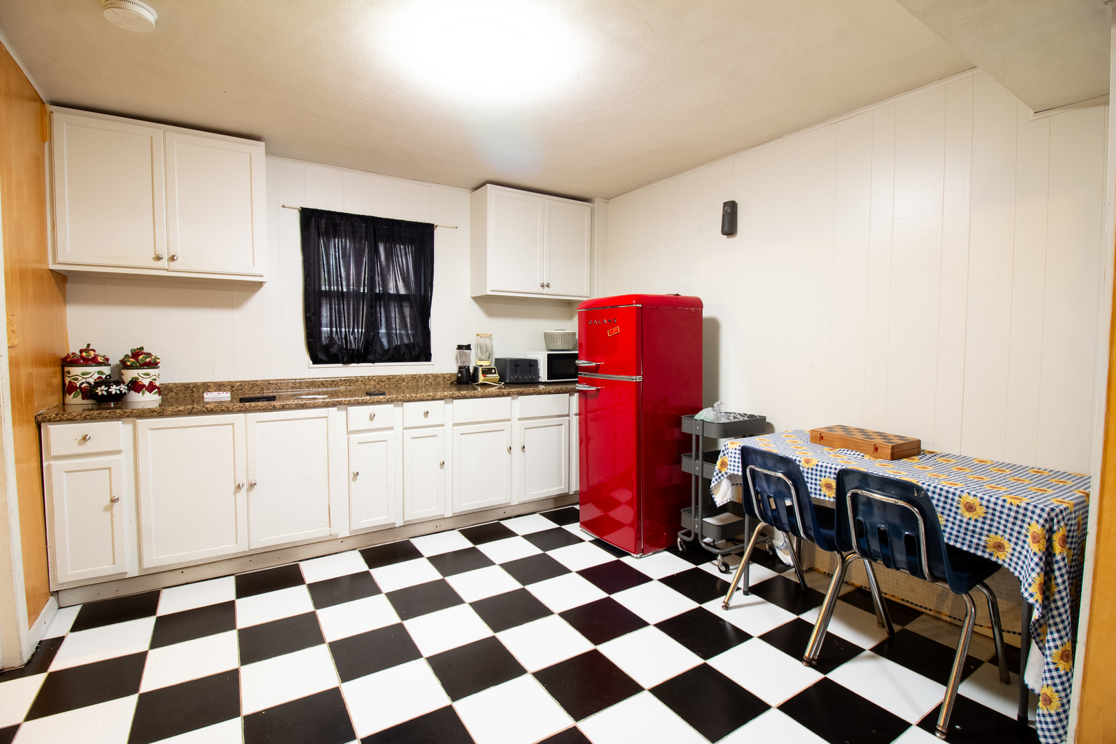 2737 Spruce Street River Grove, IL 60171 - Photo 16 of 30 a kitchen with a checkered floor and white cabinets